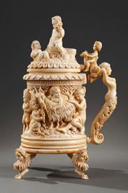 A 19th century GERMAN CARVED IVORY TANKARD