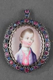 A 18th century gold pendant with miniature, sapphires and rubies. 