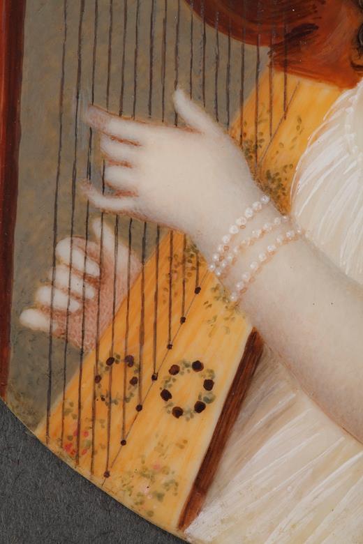 Miniature on ivory of a women playing the harp