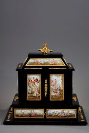 A 19th century Autrian ormolu AND ENAMEL-MOUNTED black wood Cabinet. 