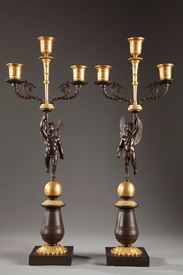 Early Nineteenth century pair of candelabra in gilded and patinated bronze with putti
