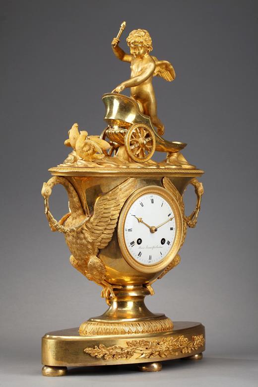 Empire clock with putto on a chariot with swan,19th century 