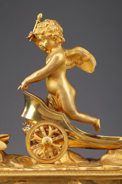 Empire mantel clock with putto on a chariot