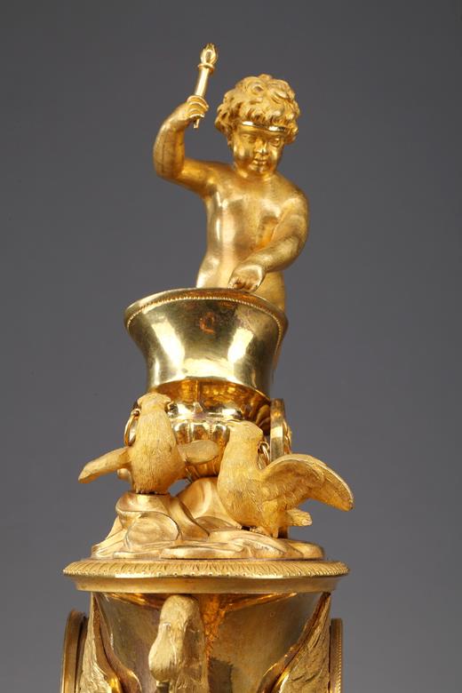 Empire clock with putto on a chariot with swan,19th century 