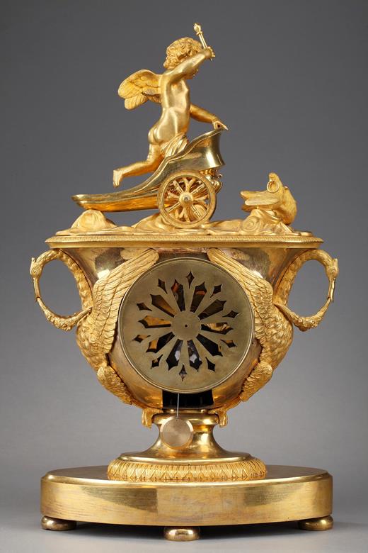 Empire mantel clock with putto on a chariot