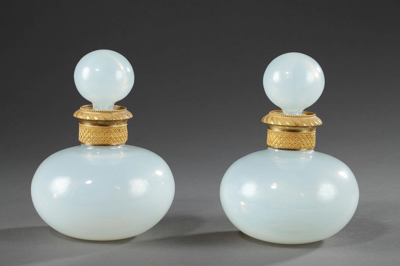 Pair of Charles X white Opaline perfume bottles.