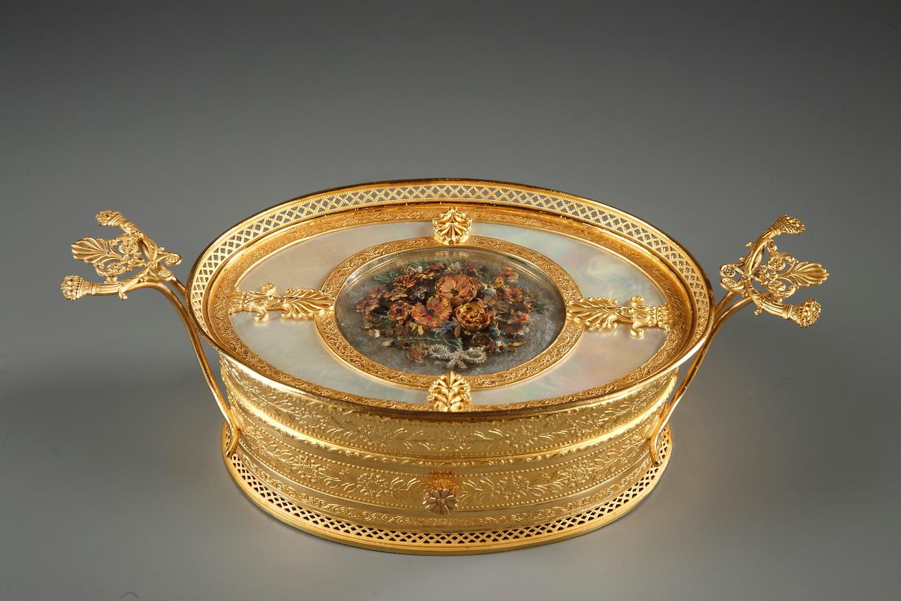 FRENCH CHARLES X GILT BRONZE AND MOTHER-OF-PEARL BOX.